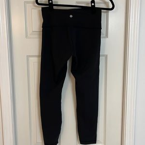 Size 8 Lululemon leggings in black.